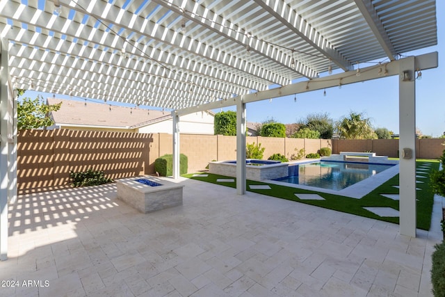 view of patio / terrace with a pergola, an outdoor fire pit, and a pool with hot tub