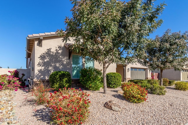 view of front of property with a garage