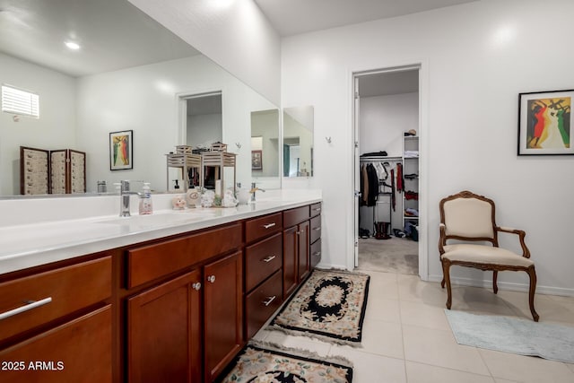 4044 E Dawson Dr E, Chandler, AZ 85249 - full bath featuring double vanity, a walk in closet, tile patterned floors, and baseboards