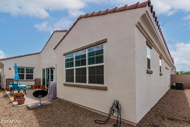 4044 E Dawson Dr E, Chandler, AZ 85249 - rear view of property featuring central air condition unit, a patio, fence, and stucco siding