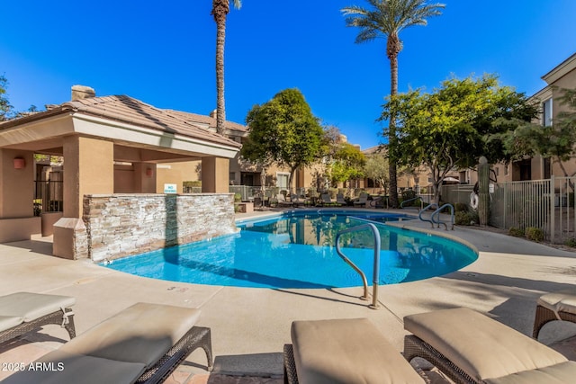 view of swimming pool with a patio