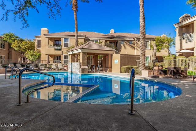 view of swimming pool with a patio area and a gazebo