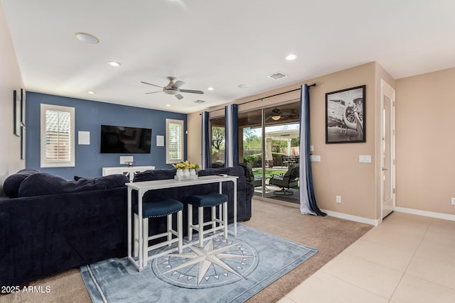 living room featuring recessed lighting, visible vents, plenty of natural light, and baseboards