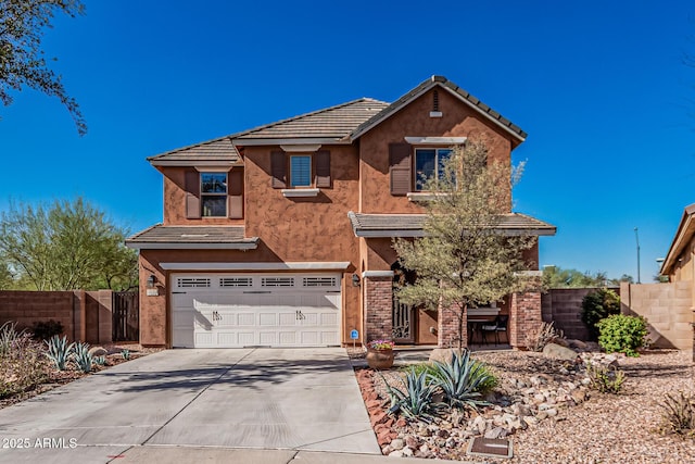 traditional-style home featuring stucco siding, concrete driveway, an attached garage, and fence