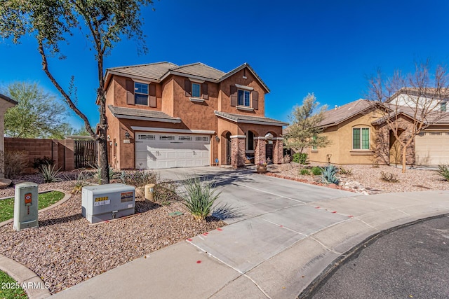 traditional-style home featuring stucco siding, driveway, fence, a garage, and a tiled roof