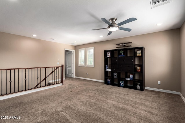 carpeted spare room with visible vents, recessed lighting, and baseboards