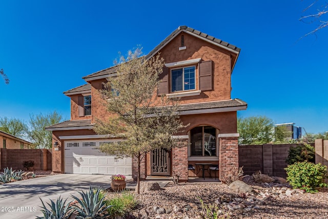 view of front of house with fence, a garage, driveway, and stucco siding