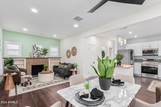 dining area featuring dark hardwood / wood-style flooring