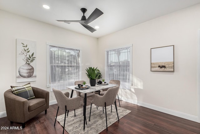 dining space featuring ceiling fan and dark hardwood / wood-style flooring