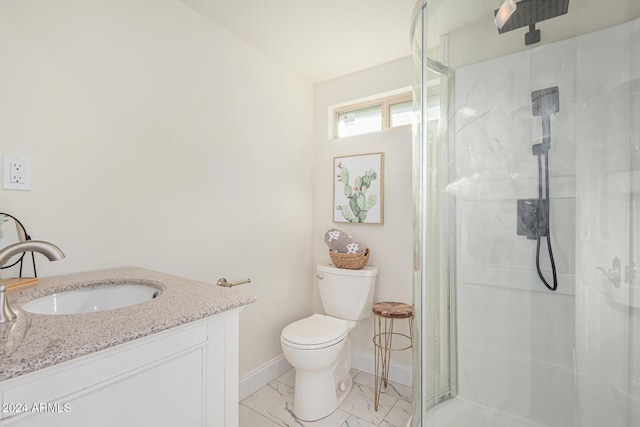 bathroom with vanity, toilet, and walk in shower