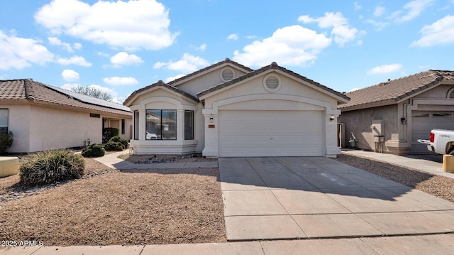 ranch-style home featuring a garage, solar panels, concrete driveway, a tile roof, and stucco siding