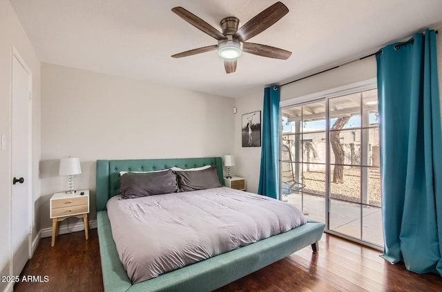 bedroom with access to exterior, ceiling fan, and dark wood-type flooring