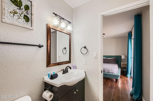 bathroom with vanity and hardwood / wood-style flooring