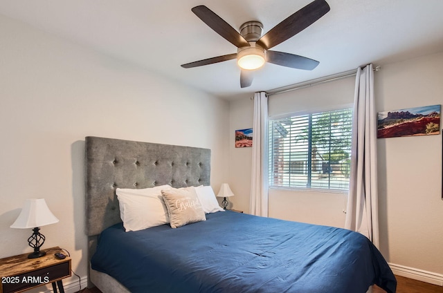 bedroom with hardwood / wood-style floors and ceiling fan