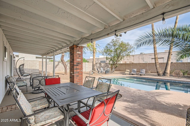 view of patio with a fenced in pool