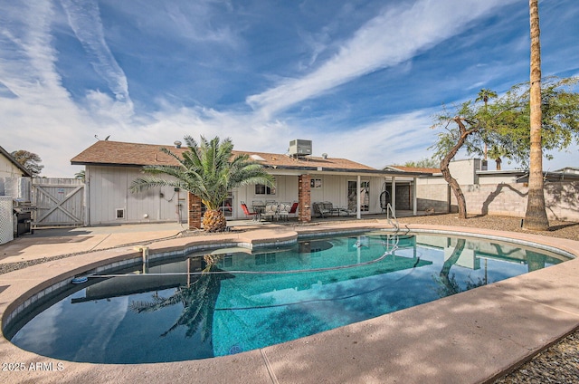 view of swimming pool with a patio area