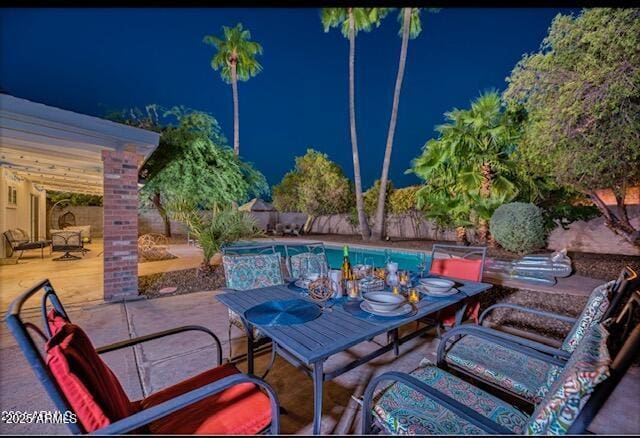 view of patio / terrace featuring a fenced in pool