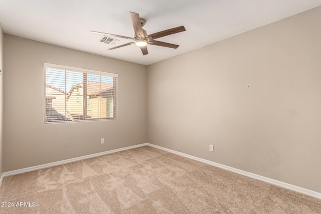 carpeted empty room with ceiling fan