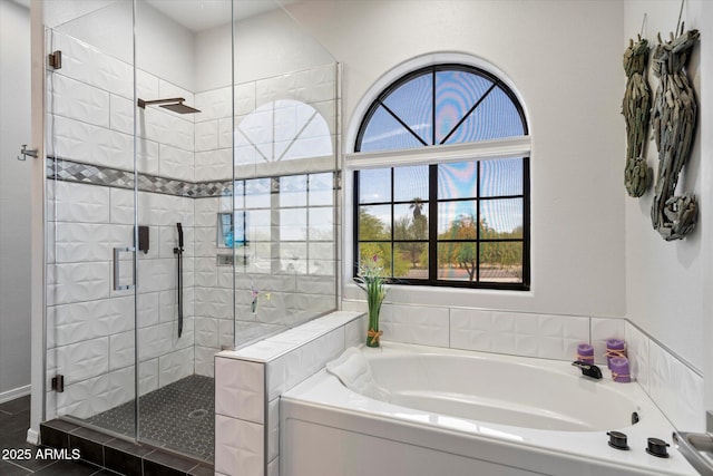 full bath with a bath and a shower stall