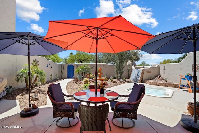 view of patio featuring a fenced backyard and outdoor dining area