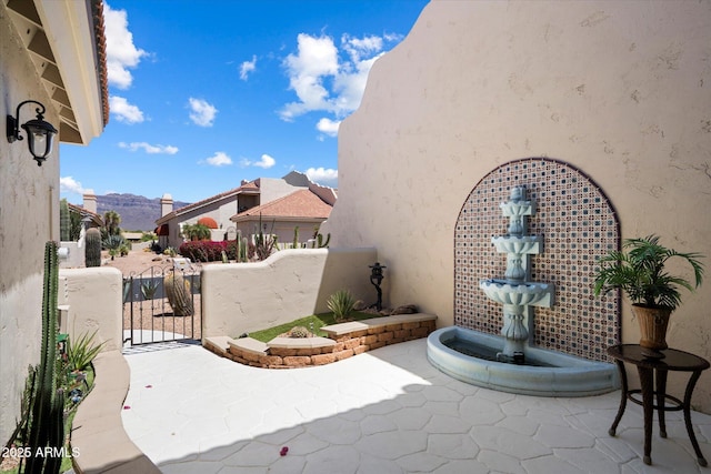 view of patio / terrace featuring a gate