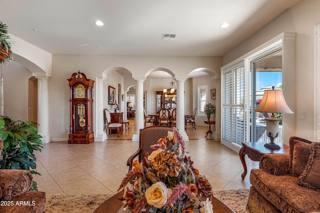 tiled living room with ornate columns