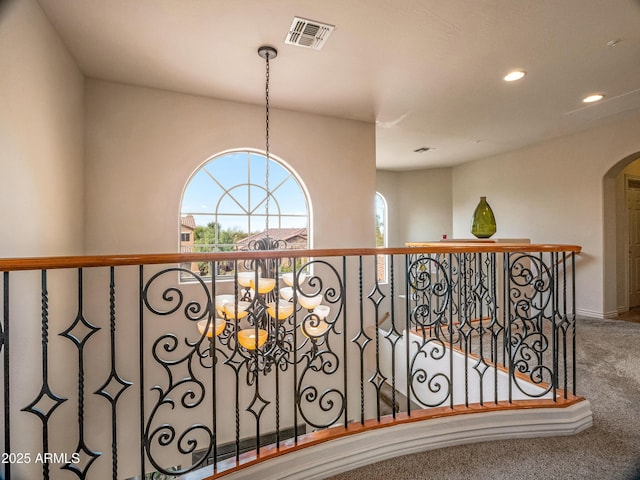 room details with a chandelier and carpet floors