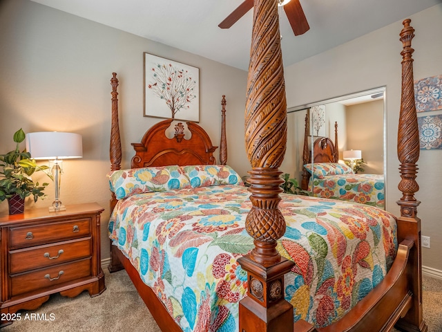 bedroom featuring ceiling fan, a closet, and light carpet