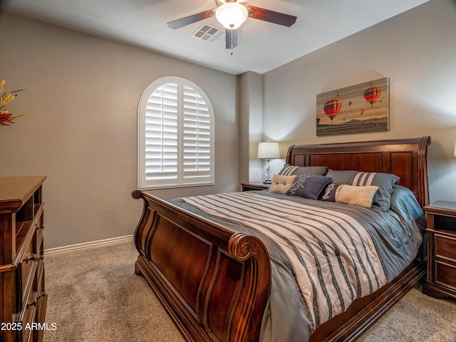 bedroom with ceiling fan and light colored carpet