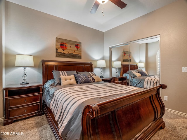 bedroom with a closet, light colored carpet, and ceiling fan