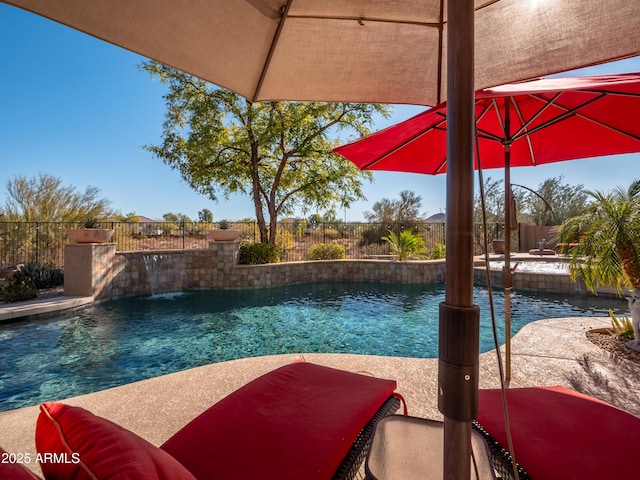 view of pool featuring pool water feature and a patio area