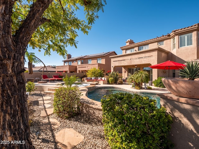 view of pool featuring a patio