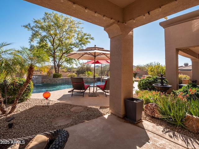 view of patio with pool water feature