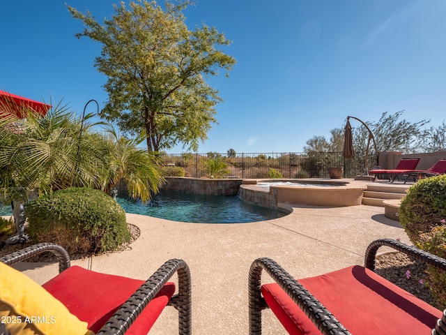 view of pool featuring an in ground hot tub and a patio