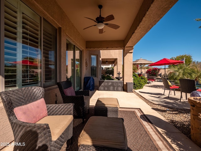 view of patio featuring an outdoor hangout area and ceiling fan