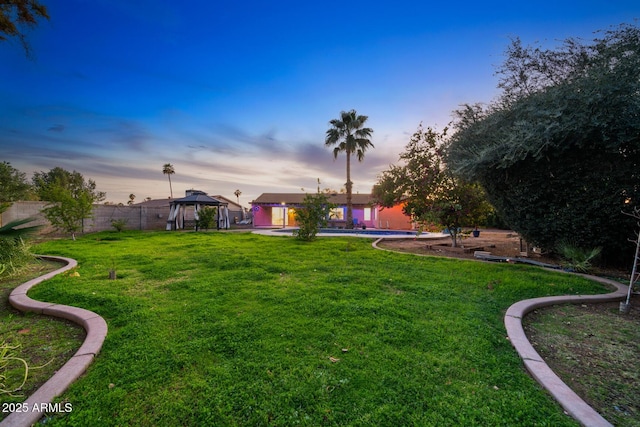 view of yard with a gazebo and fence