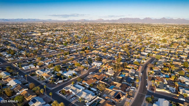 birds eye view of property featuring a mountain view and a residential view