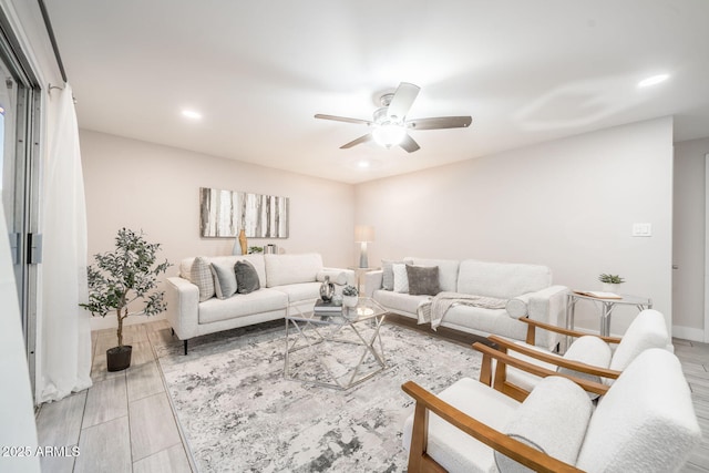 living area featuring recessed lighting, ceiling fan, and wood finished floors