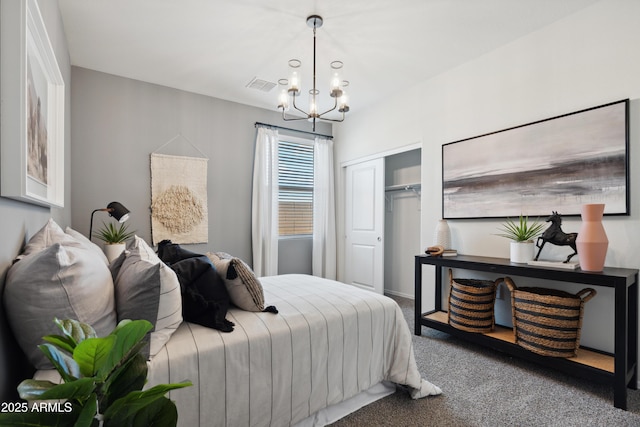 carpeted bedroom with a closet, visible vents, and an inviting chandelier