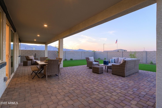 patio terrace at dusk with an outdoor living space