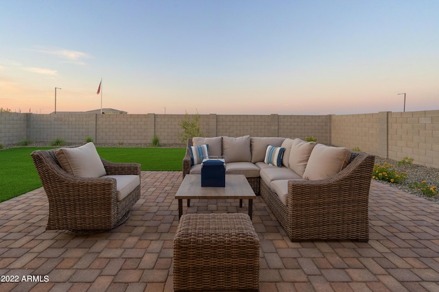 patio terrace at dusk featuring outdoor lounge area