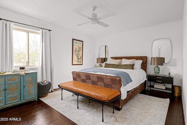 bedroom with ceiling fan and dark hardwood / wood-style floors