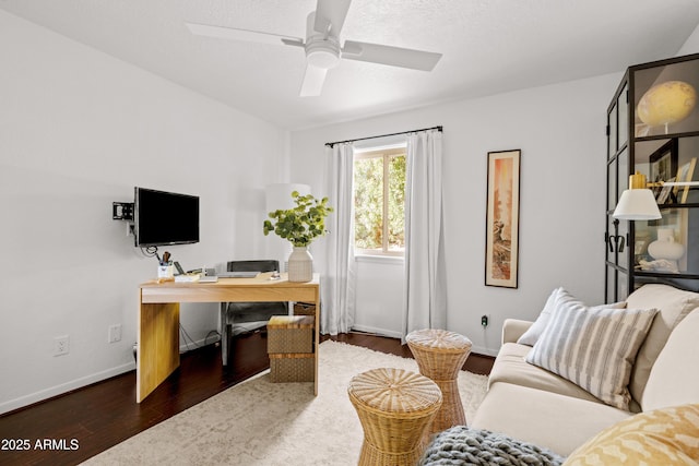 home office featuring a textured ceiling, dark hardwood / wood-style floors, and ceiling fan