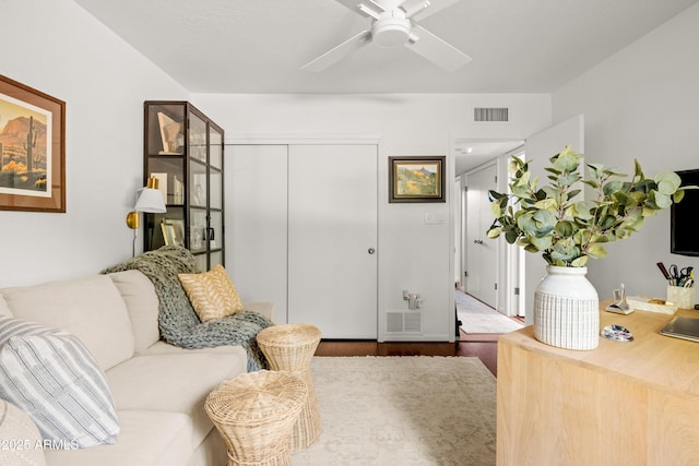 interior space featuring wood-type flooring and ceiling fan