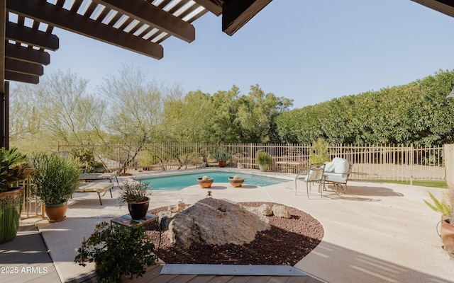 view of swimming pool featuring a pergola and a patio