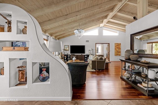 living room featuring vaulted ceiling with beams, wooden ceiling, hardwood / wood-style floors, and a notable chandelier