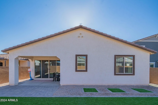 back of house with a patio area