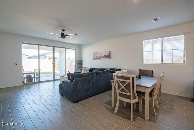 dining room with ceiling fan and hardwood / wood-style flooring