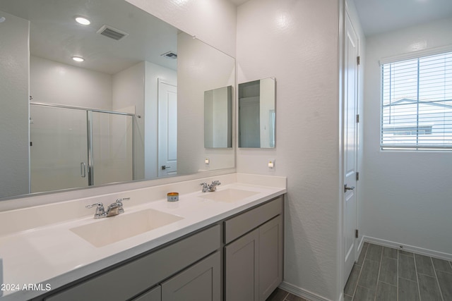 bathroom featuring vanity and walk in shower