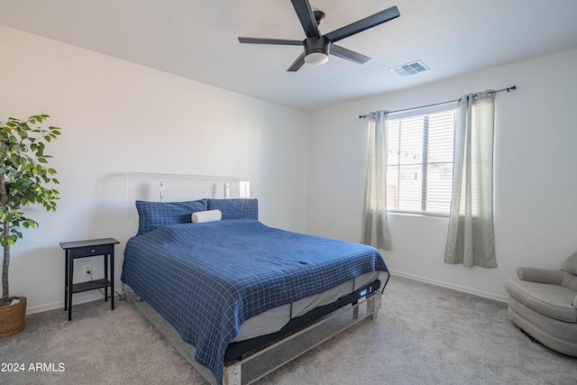 bedroom featuring ceiling fan and carpet